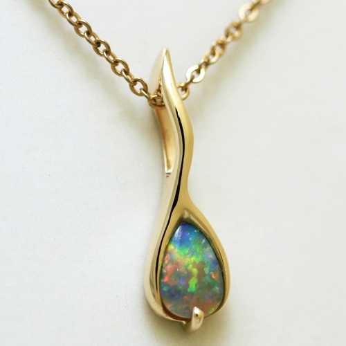 14k Yellow Gold Pendant with a SOLID SEMI BLACK OPAL Extreme fire, reds to blue, Jigsaw pattern